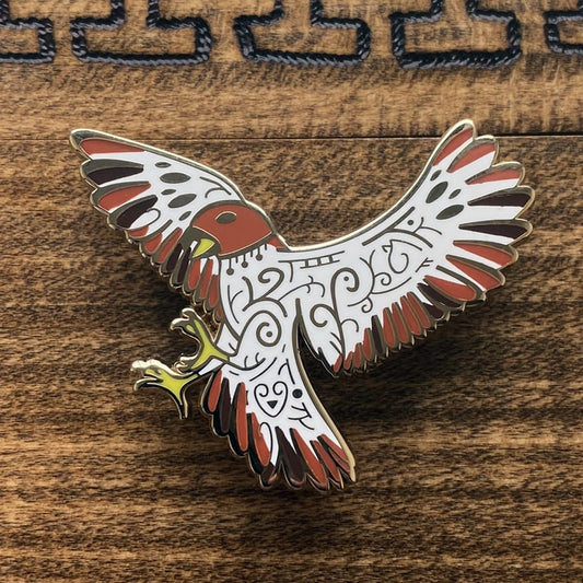 Gold-plated enamel pin of the Norse god red Freyja. Pin contains knotwork and is depicted as a falcon.