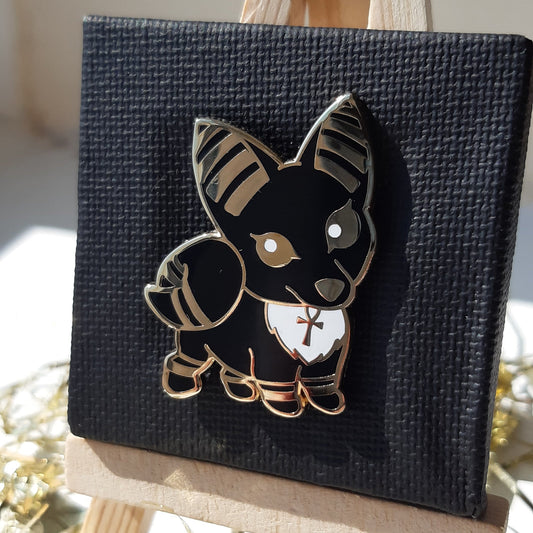 Gold-plated enamel pin of the Egyptian god Anubis, depicted as cute jackal. Pin contains ancient egyptian symbols.