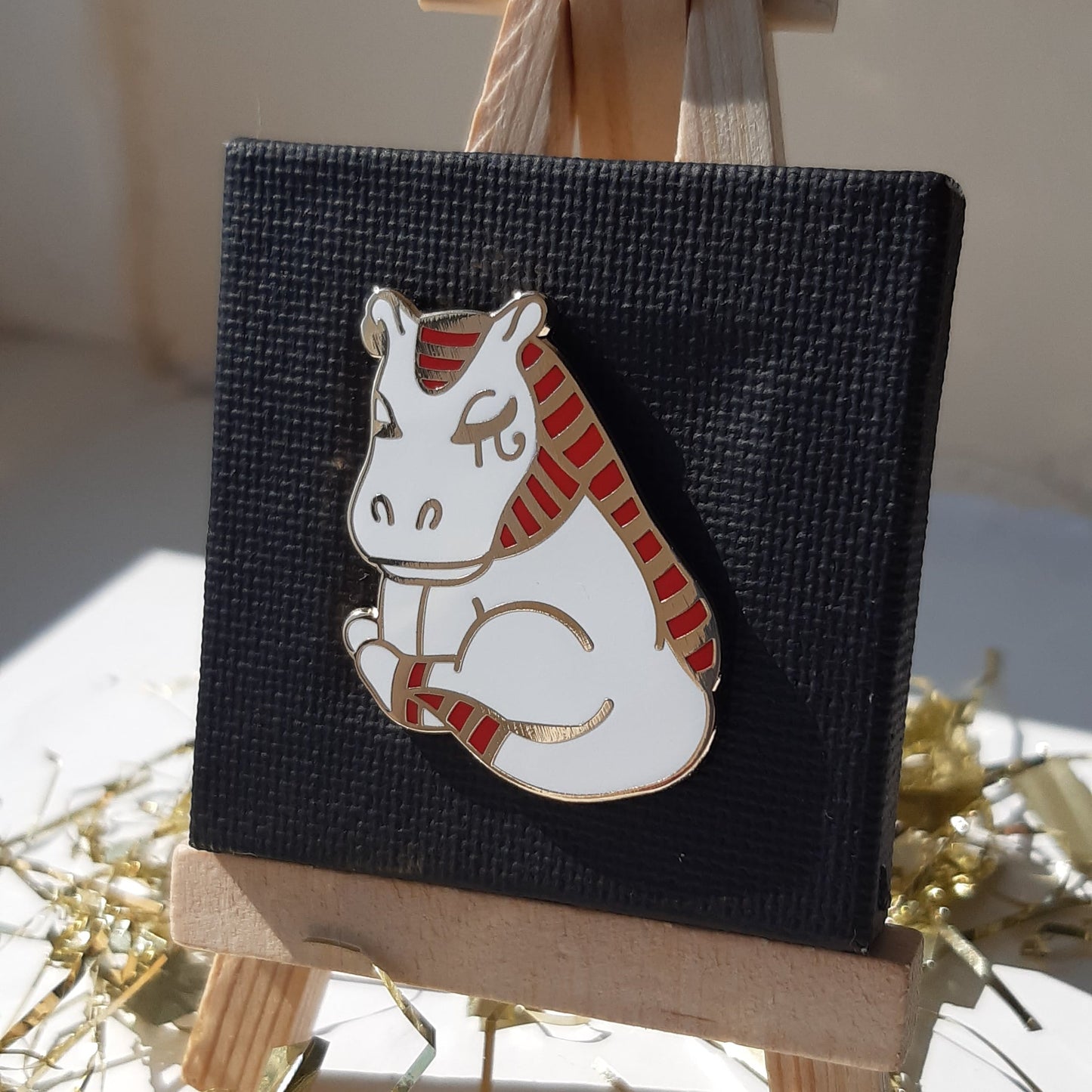 Gold-plated enamel pin of the Egyptian god Taweret, depicted as cute hippo. Pin contains ancient Egyptian symbols.